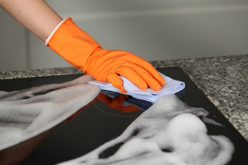 Technician managing a wet floor area with caution signage